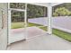 View of a screened-in porch with a concrete floor, offering a seamless transition to the outdoors at 218 Calhoun Falls Dr., Myrtle Beach, SC 29579