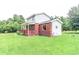 Spacious two-story home featuring a brick and siding exterior, and a welcoming front porch at 2191 Jasmine Rd., Loris, SC 29569