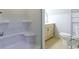 Clean bathroom with tiled floors, toilet, and vanity with sink next to built-in bathtub at 2191 Jasmine Rd., Loris, SC 29569