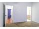 Neutral bedroom with carpet and two doorways with a glimpse into an adjoining bath at 2191 Jasmine Rd., Loris, SC 29569