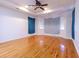Spacious bedroom with hardwood floors, tray ceiling, and modern ceiling fan at 2191 Jasmine Rd., Loris, SC 29569