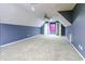 Large bonus room with carpet, dormered ceilings and neutral colored walls at 2191 Jasmine Rd., Loris, SC 29569
