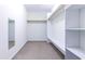 Spacious walk-in closet with shelving and clothing rods for optimal storage at 2191 Jasmine Rd., Loris, SC 29569