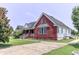 A lovely red brick home showing the side and driveway, set on a green lawn at 2191 Jasmine Rd., Loris, SC 29569