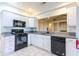 Well-appointed kitchen with white cabinets, stainless steel appliances, and granite countertops at 2191 Jasmine Rd., Loris, SC 29569