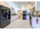 Bright kitchen featuring white cabinets, granite countertops, and modern black appliances at 2191 Jasmine Rd., Loris, SC 29569