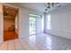 Living room featuring white tile floor and large windows leading to the outdoors at 2191 Jasmine Rd., Loris, SC 29569