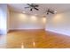 Expansive living room featuring hardwood floors and dual ceiling fans provides a bright and airy space at 2191 Jasmine Rd., Loris, SC 29569