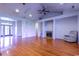 Spacious living area featuring a fireplace, ceiling fans and gleaming hardwood floors at 2191 Jasmine Rd., Loris, SC 29569