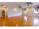 Spacious living room featuring hardwood floors and natural light from windows with staircase entrance at 2191 Jasmine Rd., Loris, SC 29569