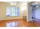 Bright living room with hardwood floors, large windows, and stylish chandelier at 2191 Jasmine Rd., Loris, SC 29569