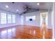 Sun-lit living space with hardwood floors, large windows and an open layout to the kitchen at 2191 Jasmine Rd., Loris, SC 29569