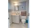 Small bathroom with classic white tile, wicker shelf, and blue accents at 2204 South Perrin Dr. # 29, North Myrtle Beach, SC 29582