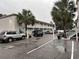 The condo building has white stairs, tropical landscaping, and parking at 2204 South Perrin Dr. # 29, North Myrtle Beach, SC 29582