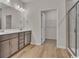 Elegant bathroom featuring a double vanity, sleek countertops, and a modern glass-enclosed shower at 2220 Flatleaf Ct, Longs, SC 29568
