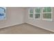 Bright bedroom with multiple windows providing natural light and a view of the outdoors at 2220 Flatleaf Ct, Longs, SC 29568