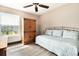 Bright bedroom with twin bed, wood-look flooring, and a large window offering natural light at 2257 Huntingdon Dr. # H, Myrtle Beach, SC 29575