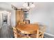 Cozy dining area with wood floors, stylish chandelier, and unique barn door detail at 2257 Huntingdon Dr. # H, Myrtle Beach, SC 29575