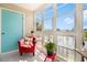 Bright sun room featuring large windows overlooking the community pond and comfortable seating at 2257 Huntingdon Dr. # H, Myrtle Beach, SC 29575