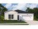 Charming single-Gathering home featuring a two-car garage, manicured lawn, and classic architectural details at 234 Ladyfish Loop, Sunset Beach, NC 28468