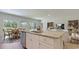 Open concept kitchen and dining area with granite countertops, modern appliances and lots of natural light at 234 Ladyfish Loop, Sunset Beach, NC 28468