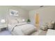 Serene main bedroom with plush bedding, neutral decor, and an ensuite bathroom, creating a relaxing retreat at 234 Ladyfish Loop, Sunset Beach, NC 28468