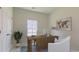 Well-lit home office with a rustic wooden desk, a comfortable chair, and a large window for natural light at 234 Ladyfish Loop, Sunset Beach, NC 28468
