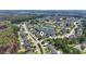 Aerial view of a suburban neighborhood featuring a centrally-located pond with fountain at 2384 Covington Dr., Myrtle Beach, SC 29579