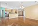 Open-concept dining area with hardwood floors, a modern chandelier, and seamless access to the kitchen and outdoor patio at 2384 Covington Dr., Myrtle Beach, SC 29579