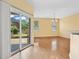Bright dining area featuring hardwood floors, sliding glass doors to a patio, and open access to the kitchen at 2384 Covington Dr., Myrtle Beach, SC 29579