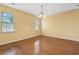 Bright dining area features hardwood floors and a charming chandelier at 2384 Covington Dr., Myrtle Beach, SC 29579