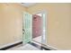 Inviting entryway featuring a tiled floor, decorative light fixture, and a stylish green front door that lets in natural light at 2384 Covington Dr., Myrtle Beach, SC 29579