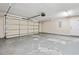 Spacious garage with a white door and concrete flooring at 2384 Covington Dr., Myrtle Beach, SC 29579