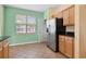 Updated kitchen featuring stainless steel refrigerator and ample cabinet space at 2384 Covington Dr., Myrtle Beach, SC 29579