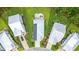 Aerial view of a modern home featuring solar panels, a patio, and a well-manicured lawn at 277 Splendor Circle, Murrells Inlet, SC 29576