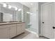Bathroom featuring double sinks, granite countertop, walk-in shower with bench and decorative tile at 277 Splendor Circle, Murrells Inlet, SC 29576