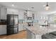 Bright kitchen with island seating, granite countertops, stainless steel appliances, and pendant lighting at 277 Splendor Circle, Murrells Inlet, SC 29576