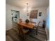 This dining room offers wood floors, natural light, and a decorative chandelier at 3001 Dewberry Dr., Conway, SC 29527