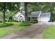 Single-story home with manicured lawn, attractive landscaping, and concrete driveway at 3001 Dewberry Dr., Conway, SC 29527
