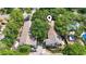 Overhead shot of the building's roofs featuring the pin, surrounded by lush greenery and nestled next to other properties at 315 73Rd Ave. N # 2, Myrtle Beach, SC 29572