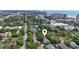 Aerial view of a property with a pin locator in a lushly treed neighborhood with city and ocean views beyond at 315 73Rd Ave. N # 2, Myrtle Beach, SC 29572