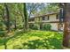 Spacious backyard with manicured lawn, mature trees and landscaping at 315 73Rd Ave. N # 2, Myrtle Beach, SC 29572