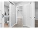 Bathroom with gray cabinets, toilet, and a view into bedroom at 315 73Rd Ave. N # 2, Myrtle Beach, SC 29572