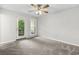 Bedroom featuring patio access through glass pane doors and a plush carpet at 315 73Rd Ave. N # 2, Myrtle Beach, SC 29572