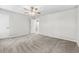 Spacious bedroom with neutral walls, plush carpet, and an en suite bathroom at 315 73Rd Ave. N # 2, Myrtle Beach, SC 29572