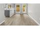 Charming dining area with hardwood floors and sliding glass doors leading to a backyard or patio at 315 73Rd Ave. N # 2, Myrtle Beach, SC 29572