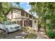 Exterior view of townhome with white car parked in front, fence, and gate at 315 73Rd Ave. N # 2, Myrtle Beach, SC 29572