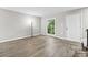 A bright living room features hardwood floors, a large window, and neutral-colored walls, creating a welcoming atmosphere at 315 73Rd Ave. N # 2, Myrtle Beach, SC 29572