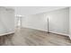 A neutral living room features hardwood floors and a glass door leading to outdoor space, providing natural light at 315 73Rd Ave. N # 2, Myrtle Beach, SC 29572