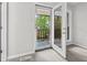 Bedroom featuring patio access through glass pane doors and window at 315 73Rd Ave. N # 2, Myrtle Beach, SC 29572